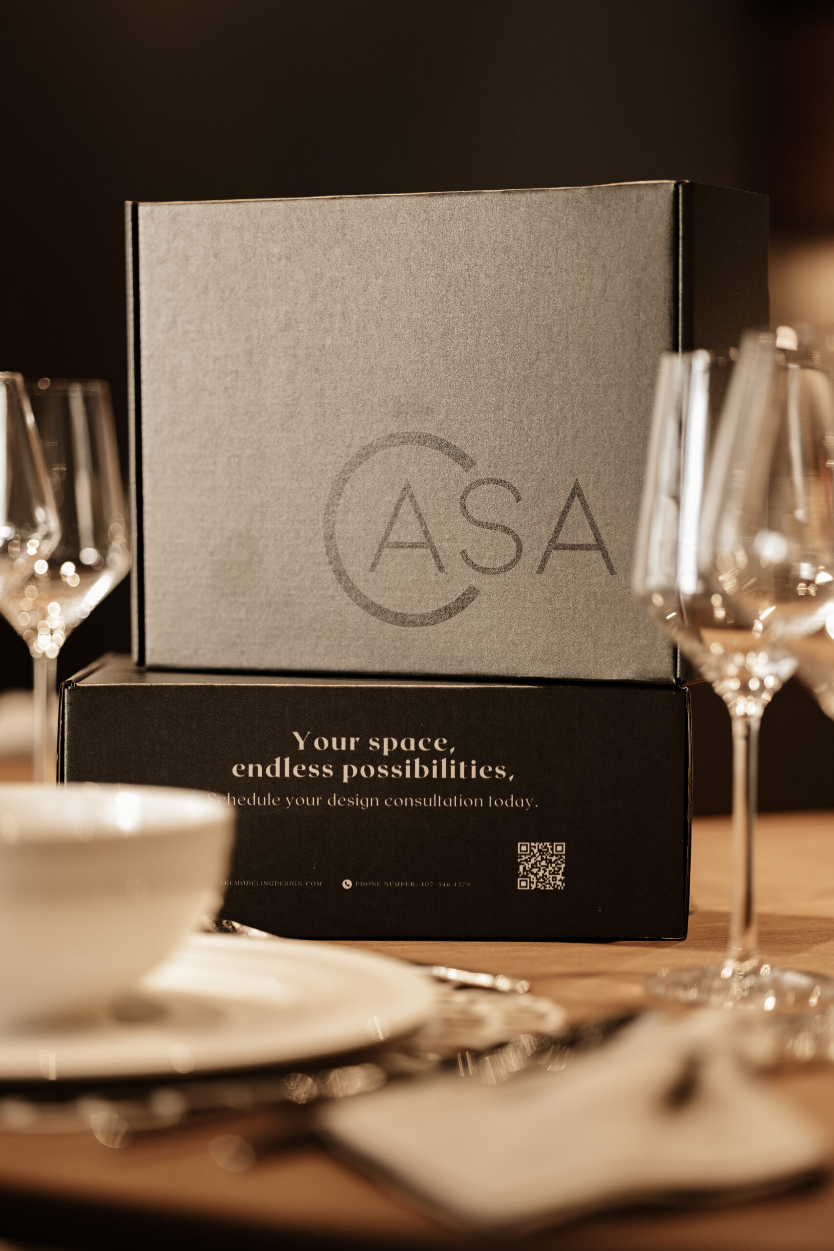 CASA Interiors design presentation box arranged at a table
